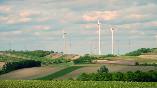 Distant wind turbines and fields in Austria