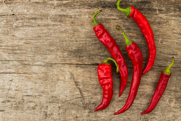 Red hot chili peppers on wooden table