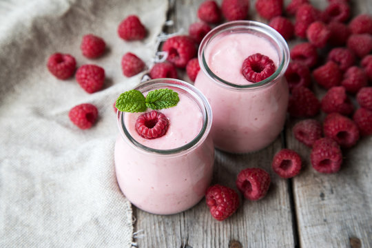 Yogurt smoothie with raspberries, fruit dessert. Berry smoothie. 