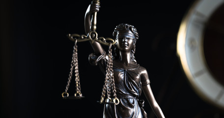 Fototapeta na wymiar Law and Justice symbols on dark background