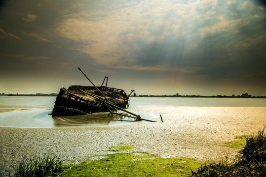 Dry and Wet: this Ship Wreck is patiently waiting for the river tides to pass near Dundalk, Co Louth, in Ireland