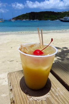 Painkiller rum cocktail on the beach in St. John, USVI, Virgin Islands, Caribbean
