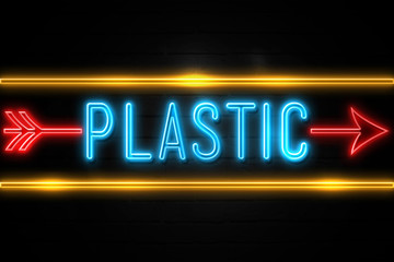 Plastic  - fluorescent Neon Sign on brickwall Front view