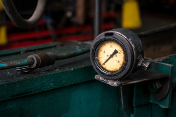 old pressure gauge on the pipeline
