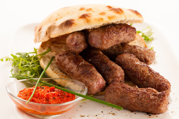 photo of Cevapi, cevapcici, traditional  Balkan food - delicius minced meat