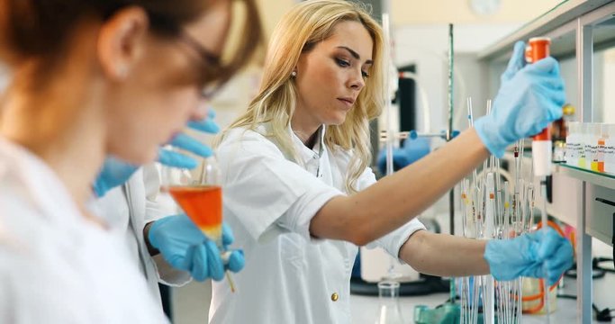 Female student of chemistry working in laboratory