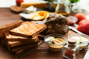 meat, toast and vegetables for a sandwich