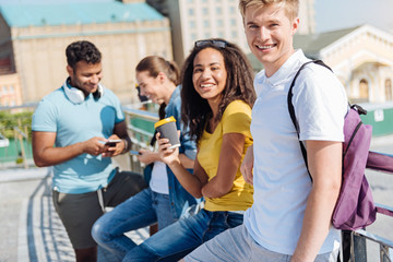 Positive group mates looking at camera