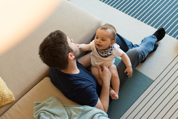 Father playing with baby