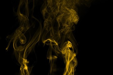 Gold smoke on black background,movement of gold smoke, Abstract gold smoke on black background, gold background,gold ink background,yellow smoke,Glittering gold smoke tail