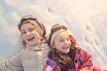 Two friends have fun on the snow