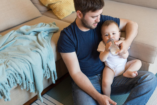 Father Feeding Baby