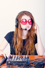 Girl behind the music console © skilas