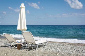 Umbrella and sunbeds on the beach