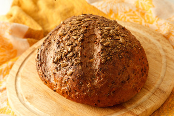 loaf of black bread on a table