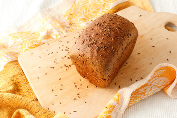 loaf of black bread on a table