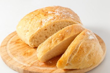 Naklejka premium loaf of white bread on a table