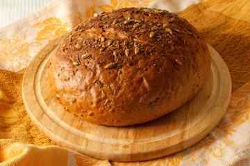 loaf of black bread on a table