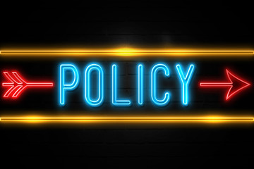 Policy  - fluorescent Neon Sign on brickwall Front view
