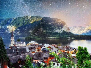 Scenic panoramic view of the famous mountain village in the Austrian Alps. Fantastic milky way. Hallstatt. Austria