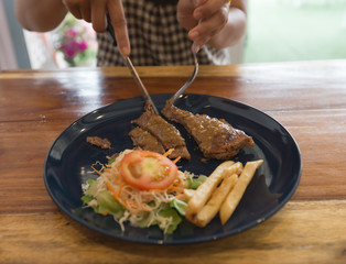 Pork steak with salad and French fries 