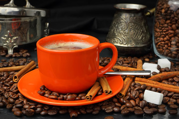 Fototapeta na wymiar Coffee still life with an orange mug and a sugar bowl