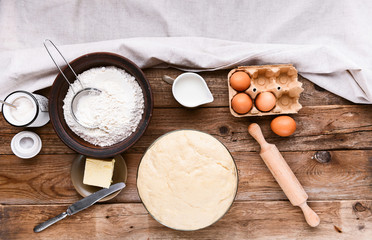 the cook makes dough next to the ingredients
