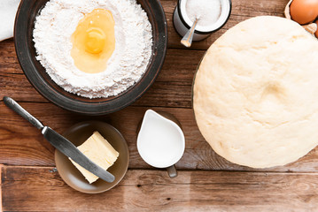 the cook makes dough next to the ingredients