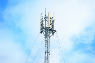 Telecommunication tower against the blue sky