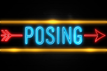 Posing  - fluorescent Neon Sign on brickwall Front view