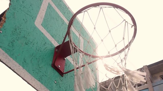 Old basketball hoop and board on blue sky