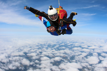 Skydiving. Tandem jump with beautiful asian girl.