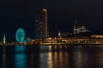 Beautiful view of Kobe Port.Night scenery of  Bay Area in Kobe City, with Landmark Tower among high rise skyscrapers with a giant Ferris wheel