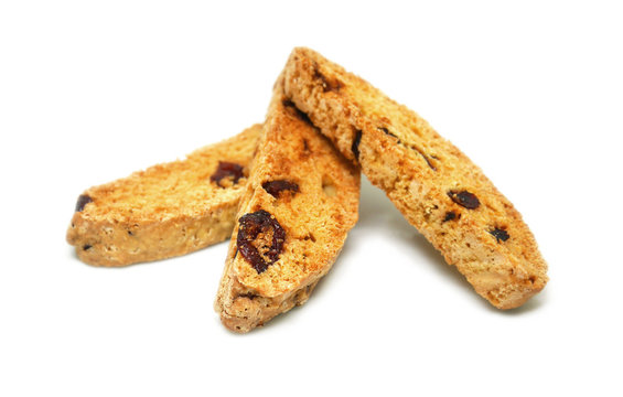 3 Pieces Of Dried Cranberry Biscotti On White Background. Biscotti Is A Traditional Hard And Dry Italian Style Cookie, Which Is Normally Eaten After Dunk In Coffee. Selective Focus With Clipping Path.