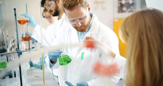 Group of chemistry students working in laboratory