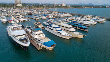 Fototapeta na wymiar Pier speedboat. A marina lot. This is usually the most popular tourist attractions on the beach.Yacht and sailboat is moored at the quay.Aerial view by drone.Top view.