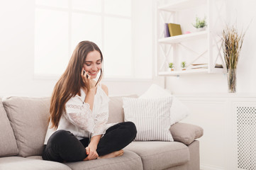 Girl at home chatting on mobile