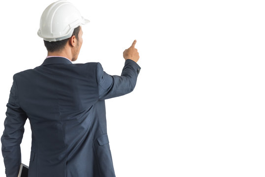 Engineer Business man touching an imaginary screen, pressing virtual button, isolated on white, back side view