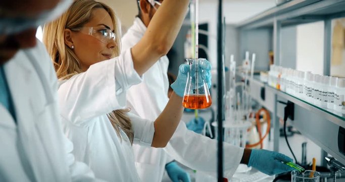 Female student of chemistry working in laboratory