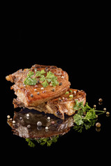 Fried meat on the fork with pepper