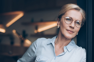 pensive woman in eyeglasses