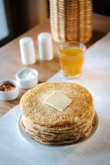 Hip of thin russian pancakes, called blini, at restaurant.