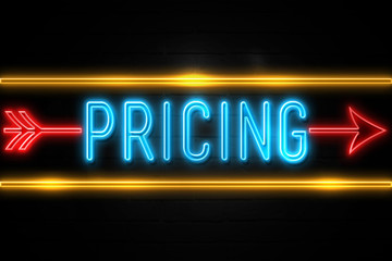 Pricing  - fluorescent Neon Sign on brickwall Front view