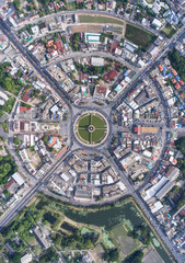 Aerial view, Road roundabout, Expressway with car lots in the city in Thailand.  beautiful Street , downtown, cityscape, Top view. Background