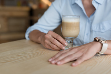 woman drinking coffee at cafe
