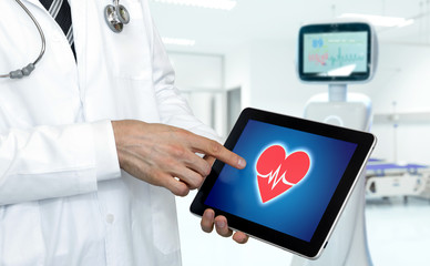 Smart health care hospital and robotic advisor service technology concept. Doctor point finger to tablet with red heart graphic screen.