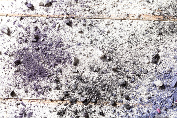 Makeup with smashed eyeshadow pigments on white wood, above view