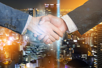Double exposure of Business partnership meeting concept.photo businessman handshake. Successful businessmen handshaking after perfect deal.close up