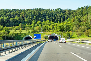 tunnel entrance / exit with cars, highway