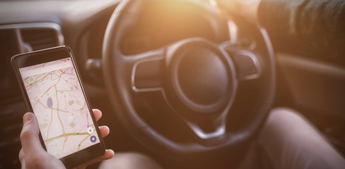 man looking at GPS on his phone